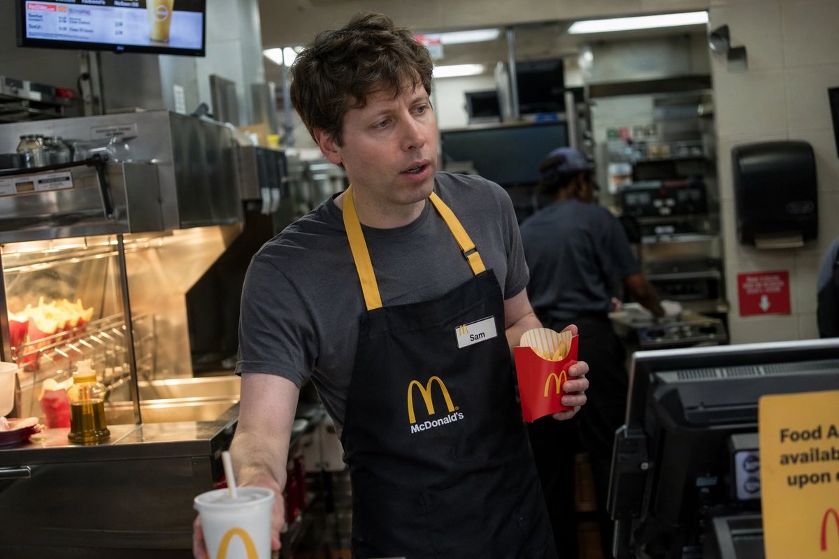 Celebrity Fast Food Worker Candid 的 Qwen Image 提示词示例图：Generates a photorealistic, candid image of a famous person working an everyday job at a fast-food restaurant.