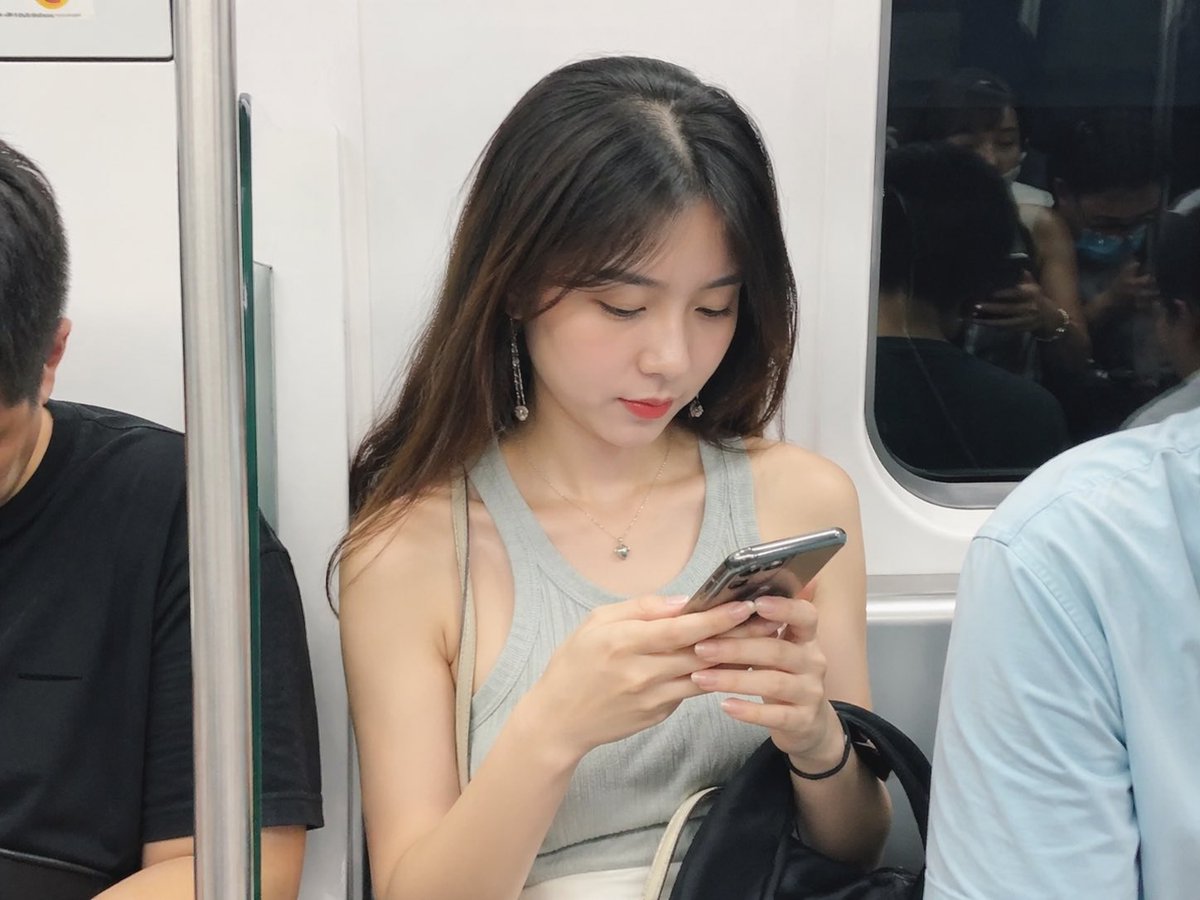 Realistic Subway Snapshot GPT Image 2 prompt example: A simple yet effective prompt for generating a realistic, candid photo of a person on a subway.
