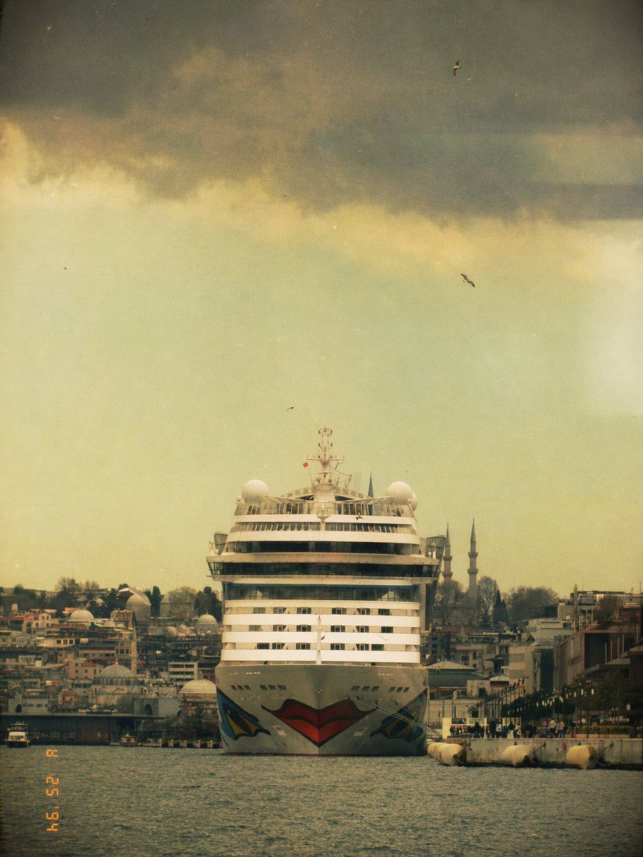 Vintage Cruise Ship in Istanbul Qwen Image prompt example: This prompt generates a nostalgic film-style travel photograph of a cruise ship approaching the Istanbul waterfront,...