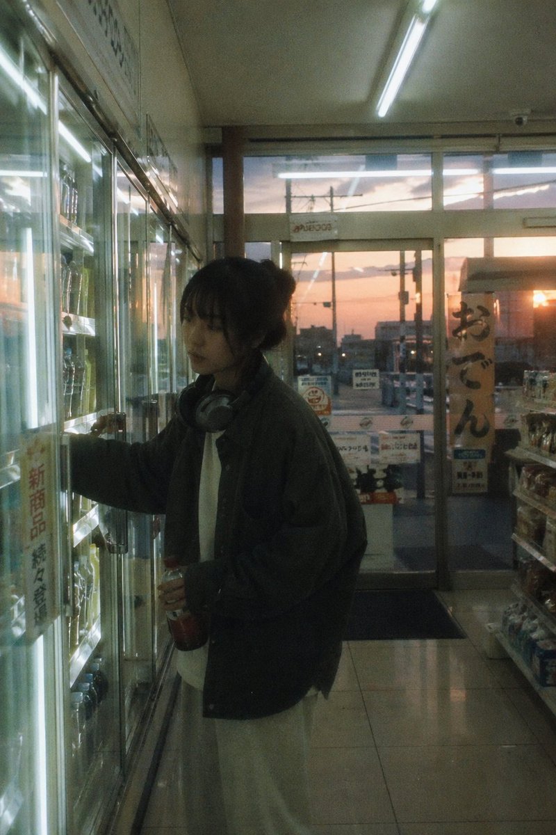 Japanese Negative Film Aesthetic GPT Image 2 prompt example: Captures a nostalgic, everyday atmosphere in a Japanese convenience store using a negative film aesthetic with soft...