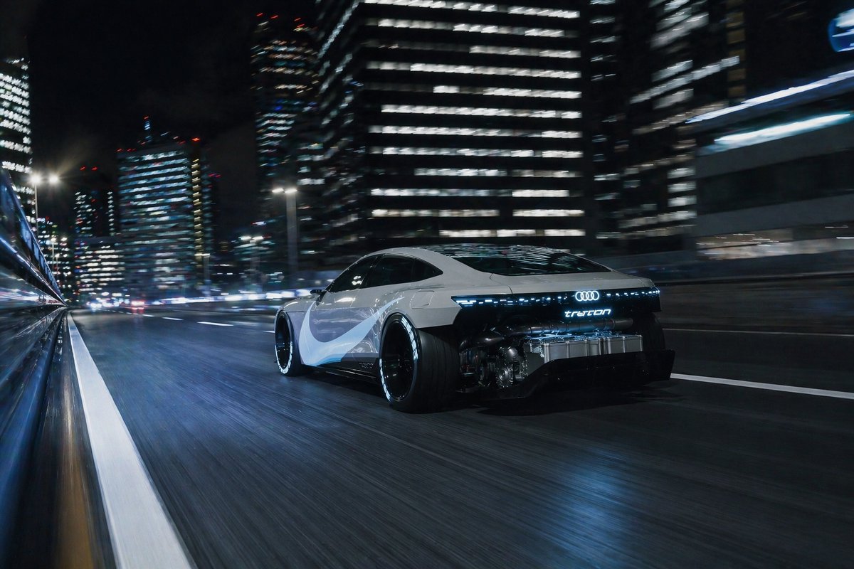 Futuristic EV Racing Through City Night Qwen Image prompt example: This prompt generates a photorealistic concept electric coupe speeding through a neon-lit city at night, ideal...