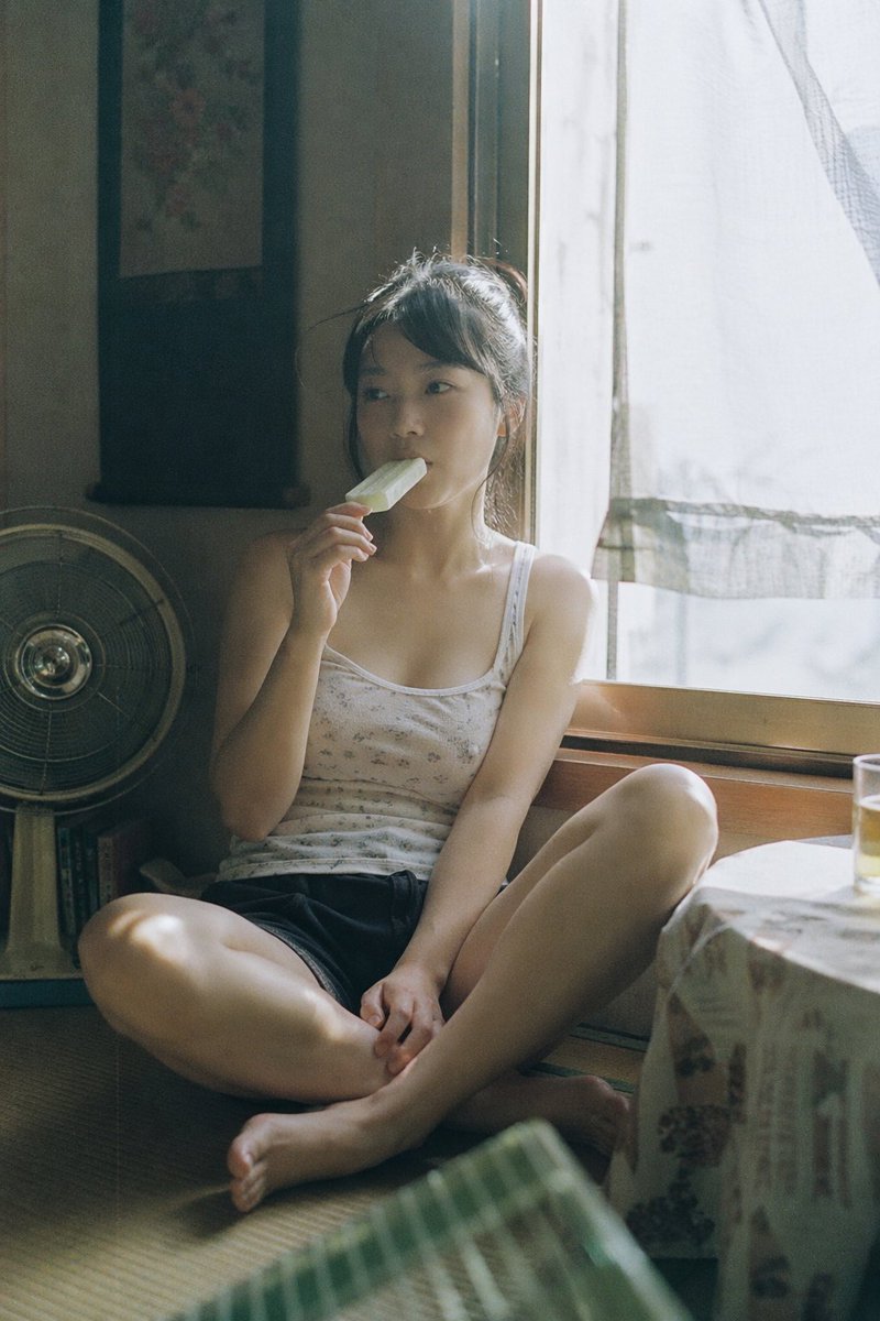 Summer Ice Cream Moment Qwen Image 프롬프트 예시: A prompt depicting a quiet summer afternoon scene of a girl eating ice cream, styled with film photography texture.