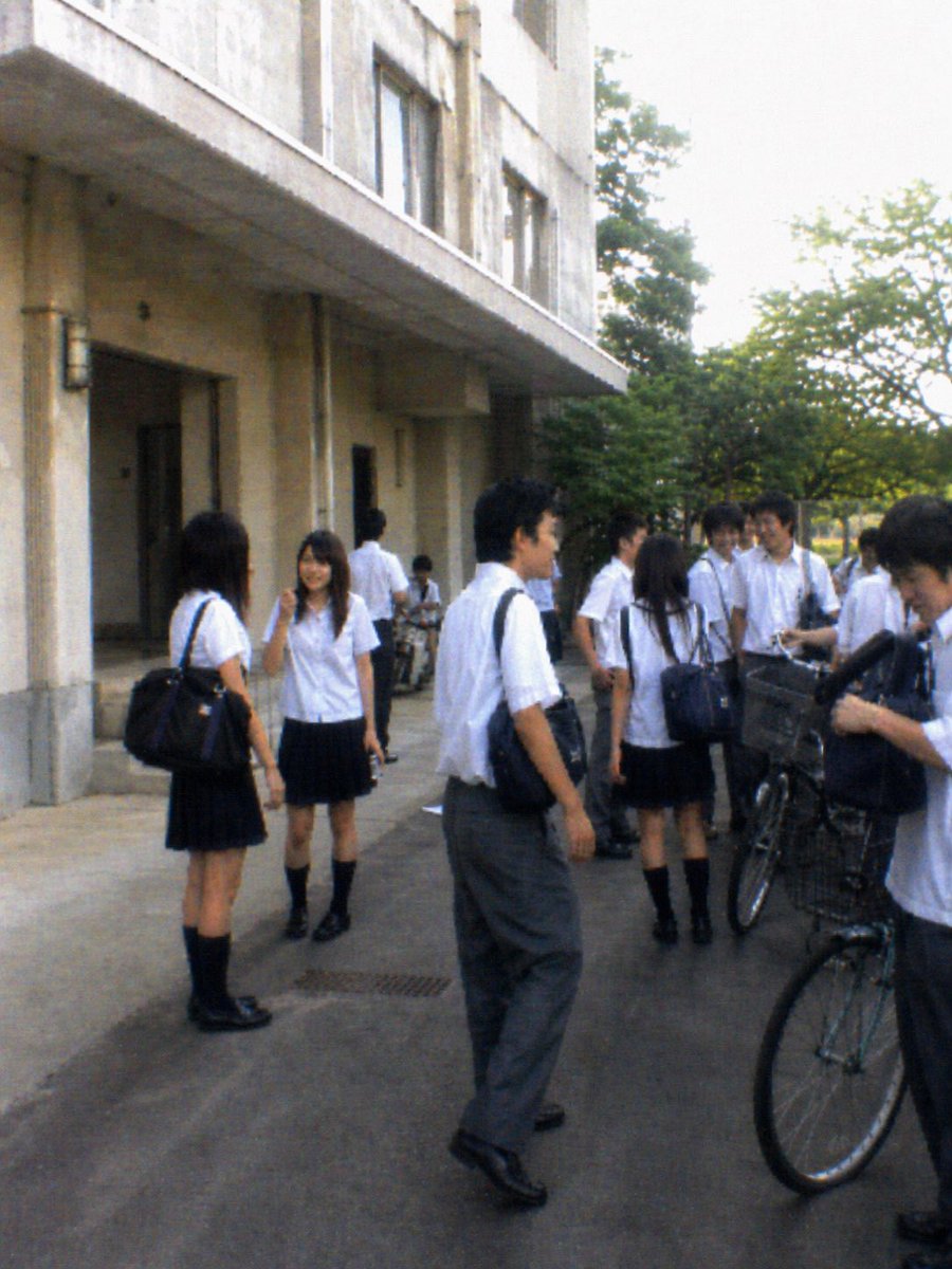 Nostalgic 2010s School Photo Qwen Image prompt example variation 3: A highly detailed prompt for generating low-quality, nostalgic photos of Japanese high school students hanging...