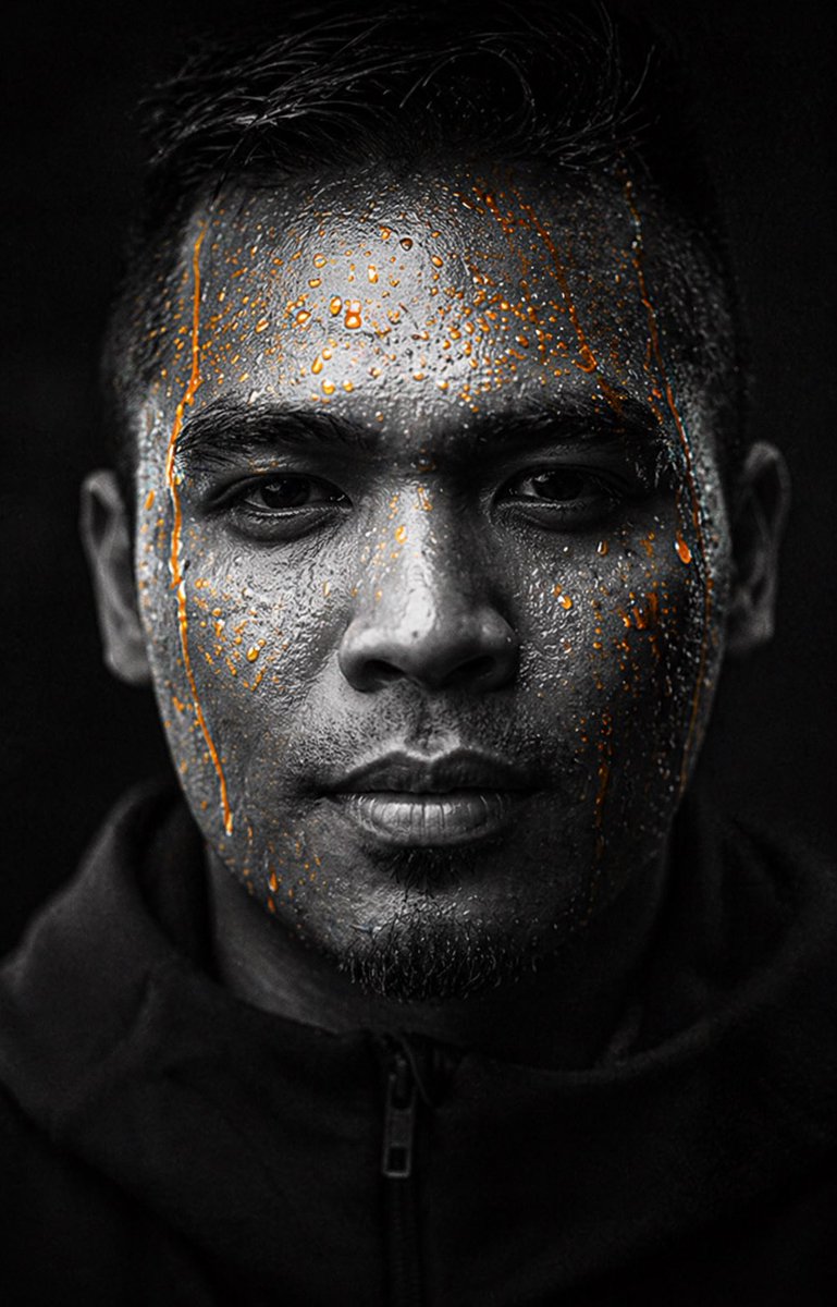 Dark Gatorade-Style Portrait 的 Qwen Image 提示词示例图：This prompt generates a moody, nearly monochrome athletic portrait with dramatic low-key lighting, ideal for...
