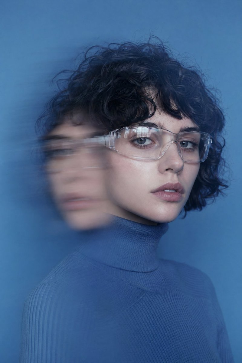 Double Exposure Motion Blur Portrait Qwen Image prompt example: A stylized portrait prompt featuring a double-exposure motion blur effect, icy color palettes, and futuristic...