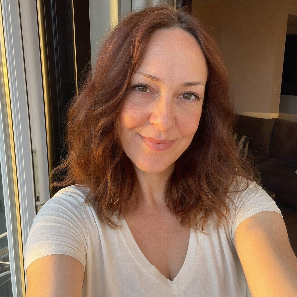 Realistic Golden-Hour Indoor Selfie Qwen Image prompt example: A natural-looking smartphone selfie prompt for generating believable casual indoor portraits with warm sunset...