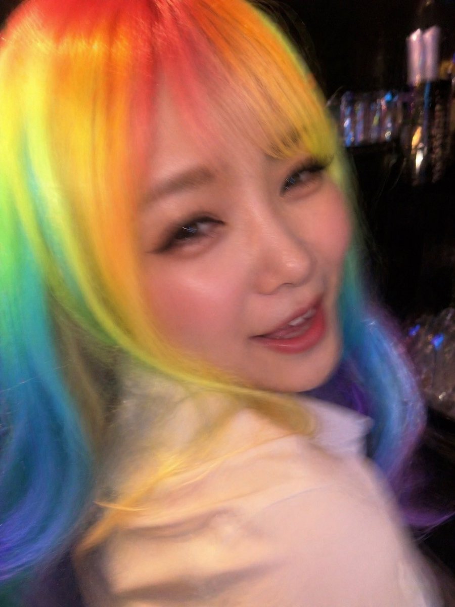 Awkward Blurry Nightclub Rainbow Hair Shot Qwen Image prompt example: Generates a deliberately bad candid nightclub photo with rainbow hair and heavy motion blur, useful for...