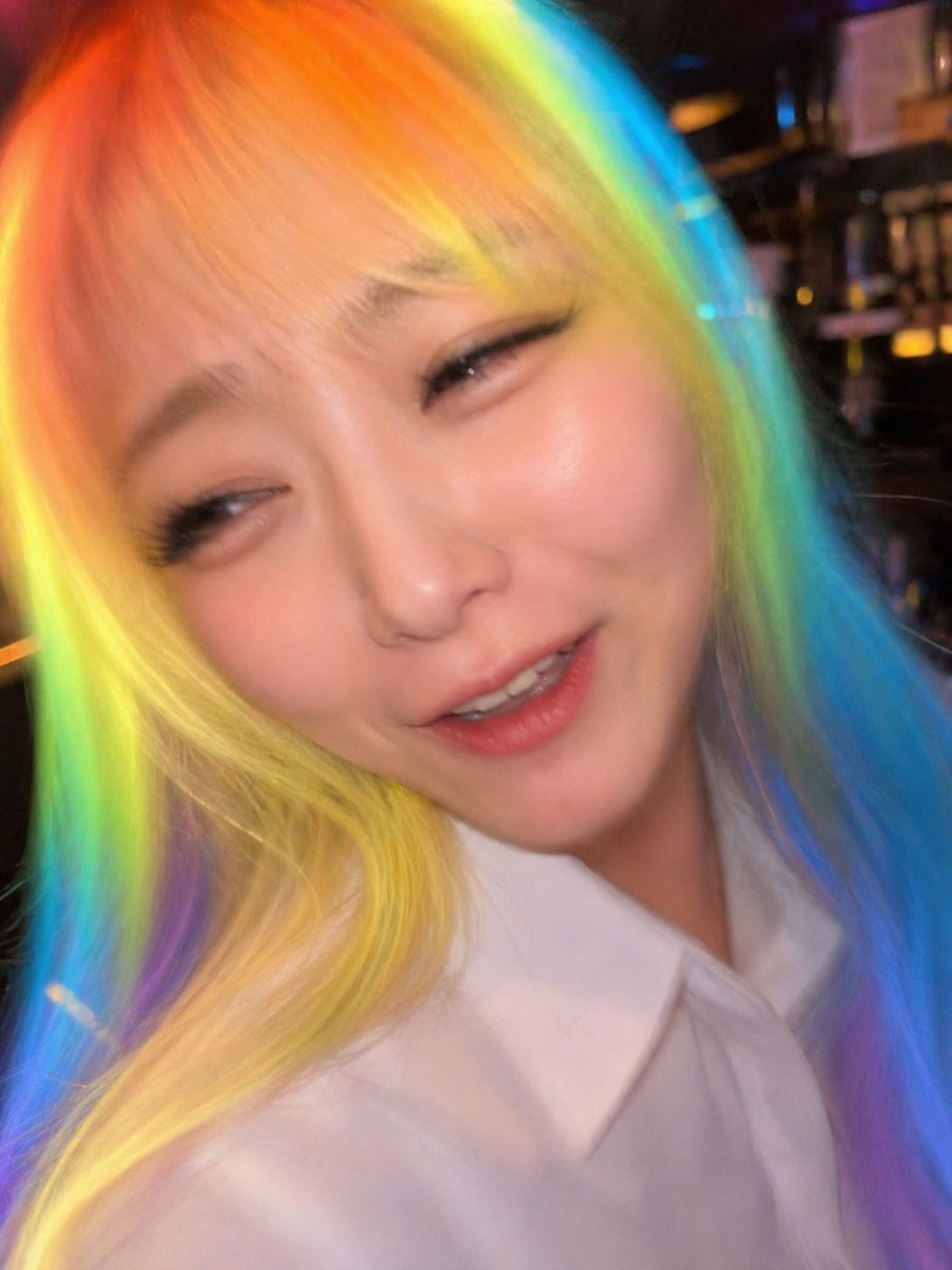 Awkward Blurry Nightclub Rainbow Hair Shot Qwen Image prompt example variation 2: Generates a deliberately bad candid nightclub photo with rainbow hair and heavy motion blur,...