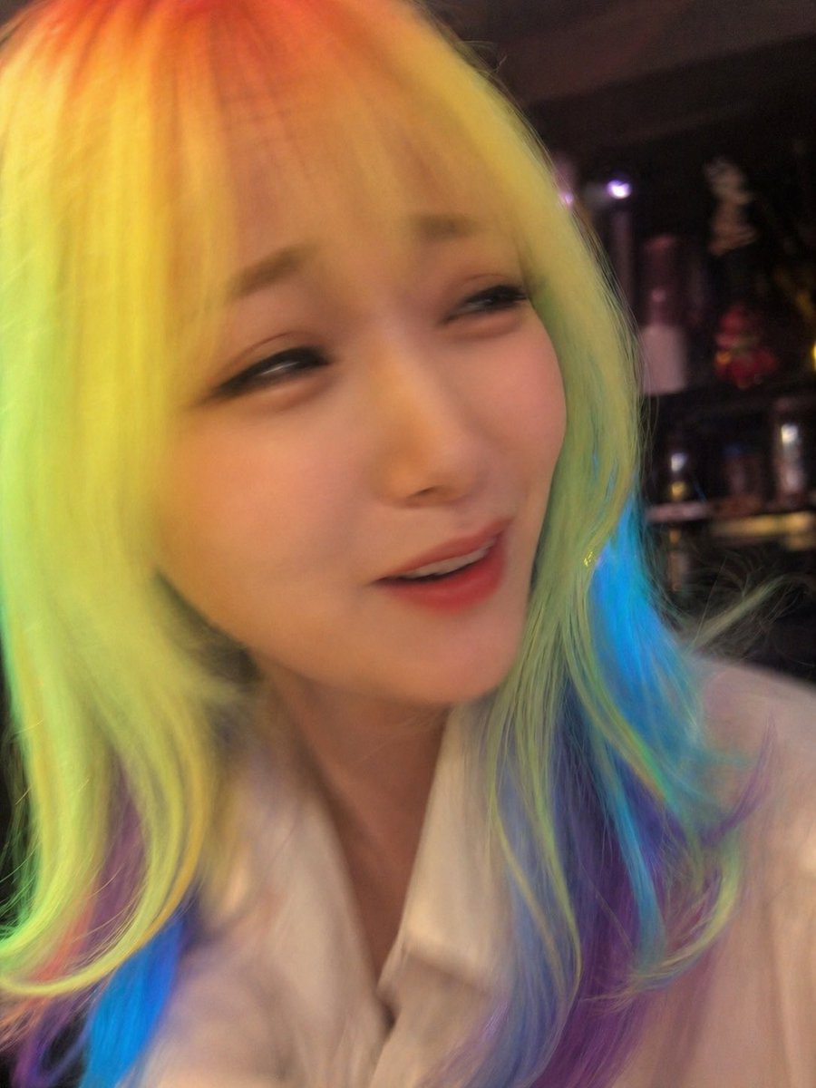 Awkward Blurry Nightclub Rainbow Hair Shot Qwen Image prompt example variation 3: Generates a deliberately bad candid nightclub photo with rainbow hair and heavy motion blur,...